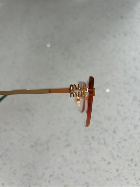 Miu Miu Pink Gradient Rimless Sunglasses with Gold Temples and Green Tips main image 5